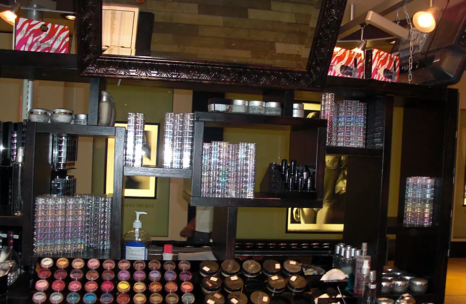 Kiosk shelves stocked with BELLATERRA mineral makeup